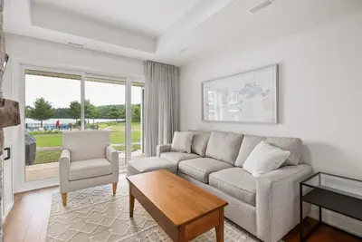 a living room with a couch and a table at Touchstone Resort in Bracebridge