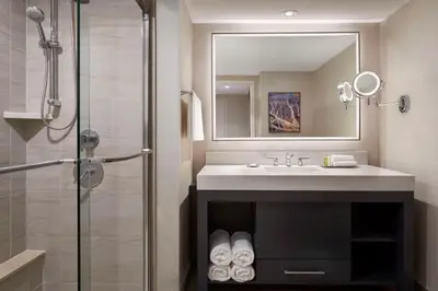 a bathroom with a sink and a shower at Hilton Toronto in Toronto