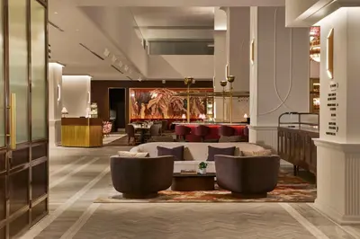 a lobby of a hotel with couches and chairs at Hilton Toronto in Toronto