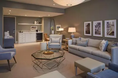a living room with a couch and chairs and a table at Hilton Toronto in Toronto