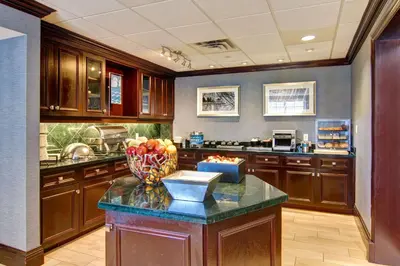 a kitchen with a counter with a bowl of fruit on it at Homewood Suites by Hilton Toronto Mississauga in Mississauga