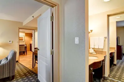 a hotel room with a bathroom with a sink at Homewood Suites by Hilton Toronto Mississauga in Mississauga