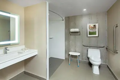 a bathroom with a white toilet and a sink at Hilton Garden Inn Toronto-Oakville in Oakville