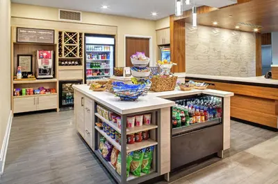 a store with a counter with food and drinks at Hilton Garden Inn Toronto-Oakville in Oakville