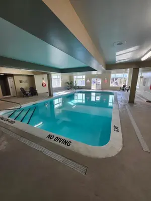 a large swimming pool in a large building at Days Inn by Wyndham Orillia in Orillia