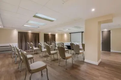 a conference room with a long table and chairs at Best Western St Catharines Hotel & Conference Centre in St. Catharines
