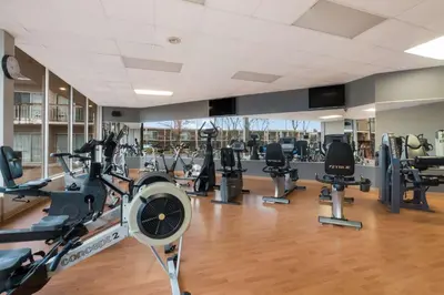 a gym with treadmills and cardio machines at Best Western St Catharines Hotel & Conference Centre in St. Catharines