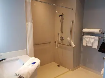 a bathroom with a shower and a bath tub at Best Western Plus Barrie in Barrie