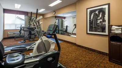 a fitness room with a gym with a treadmill at Best Western Plus Barrie in Barrie