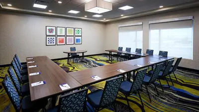 a conference room with a long table and chairs at Holiday Inn Express & Suites - Brantford by IHG in Brantford