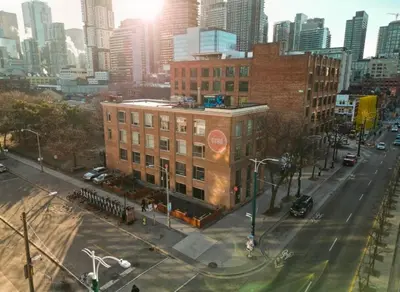 a building on a street in a city at Hotel Ocho in Toronto