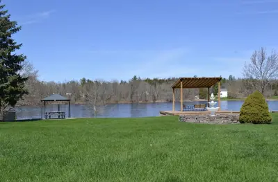 a gazebo and a gazebo on a lawn next to at Motel 6 Campbellford, ON in Campbellford