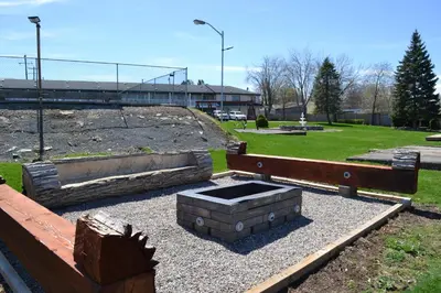 a fire pit in the middle of a park at Motel 6 Campbellford, ON in Campbellford
