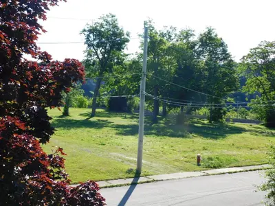 a pole on the side of a street with a field at Rainbow Bed & Breakfast in Niagara Falls