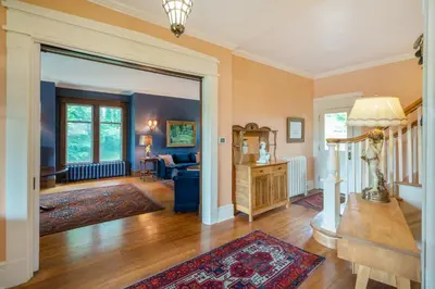 a living room with a couch and a table at Lion's Head B&B in Niagara Falls