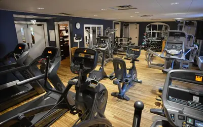 a gym with several treadmills and cardio machines at Pillar and Post Inn & Spa in Niagara on the Lake