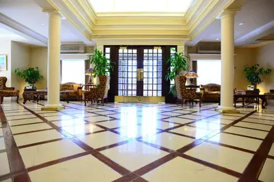 a lobby with chairs and tables in a building at Queens Landing in Niagara on the Lake