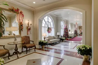 a lobby with a christmas tree and a living room at Queens Landing in Niagara on the Lake