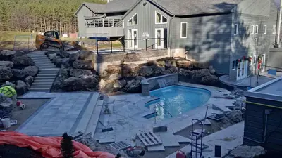 a swimming pool in front of a house at Millcroft Inn & Spa in Alton