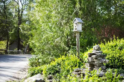 a bird house sitting on top of a pile of rocks at Millcroft Inn & Spa in Alton