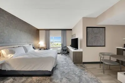 a hotel room with a bed and a television at Hilton Garden Inn Toronto/Brampton in Brampton