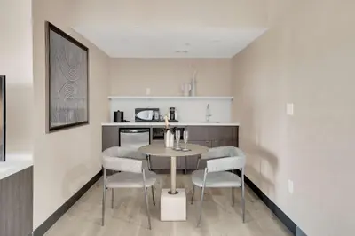 a kitchen with a table and chairs in a room at Hilton Garden Inn Toronto/Brampton in Brampton