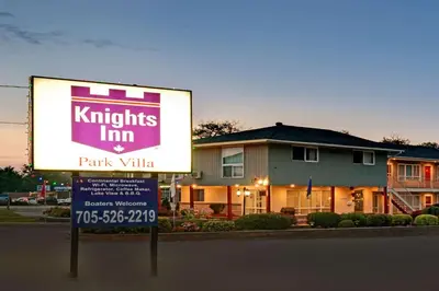 a sign in front of a park villa at Knights Inn - Park Villa Motel, Midland in Midland