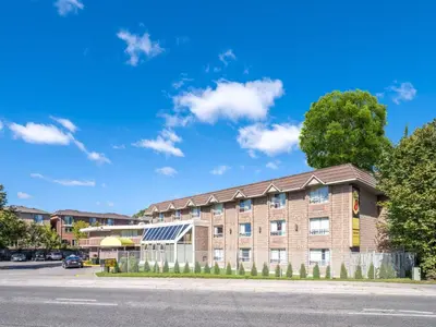 an image of the front of a building at Super 8 by Wyndham Toronto East ON in Toronto