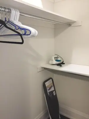a walk in closet with a shelf and a phone at Comfortable private space in Pickering