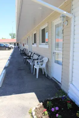 a row of benches on the side of a building at Blue Jay Motel in Peterborough