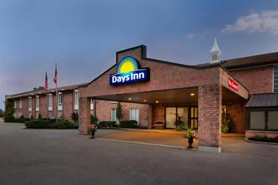 a building with a sign on the front of it at Days Inn by Wyndham Brantford in Brantford