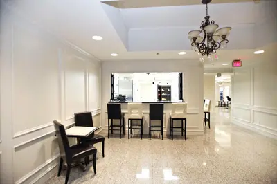 a dining room with a table and chairs at Montecassino Hotel & Event Centre in Toronto
