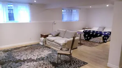 a living room with a couch and a table at HB Guest Home 4 in Waterloo