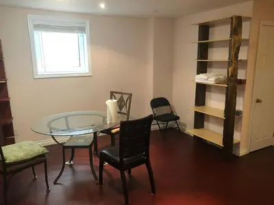 a dining room with a glass table and chairs at HB Guest Home 5 in Waterloo