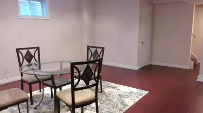 a dining room with a glass table and chairs at HB Guest Home 5 in Waterloo