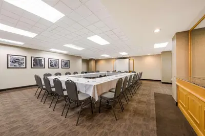 a conference room with a long table and chairs at Best Western Voyageur Place Hotel in Newmarket