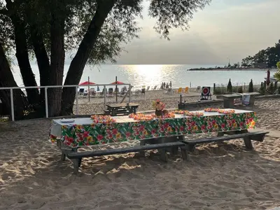 a table on the beach with flowers on it at SunPort Beach Resort in Balm Beach