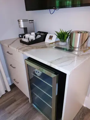 a kitchen with a dishwasher in a counter top at The Glenerin Inn in Mississauga