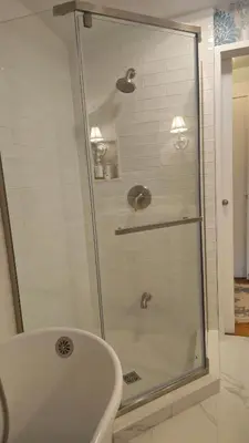 a shower with a glass door in a bathroom at Historic Wilson-Guy House in Niagara on the Lake
