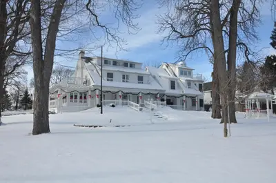 a large white house with snow on the ground at Chestnut Inn in Niagara Falls