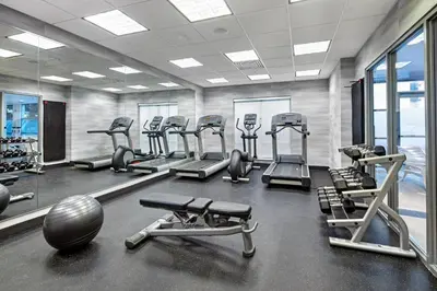 a gym with several treadmills and cardio machines at Fairfield Inn & Suites by Marriott Toronto Mississauga in Mississauga