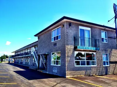 a large brick building with a lot of windows at Angus Inn Motel in Angus