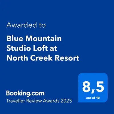 a blue mountain studio light at north creek resort with the text awarded to blue mountain at Blue Mountain Studio Loft at North Creek Resort in Blue Mountains