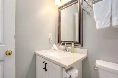 a bathroom with a sink and a mirror at Blue Mountain Studio Loft at North Creek Resort in Blue Mountains