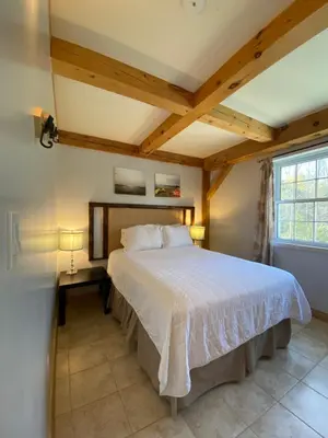 a bedroom with a large bed in a room at Timber House Resort in Brighton