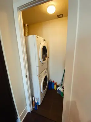 a washer and dryer in a laundry room at Luxury condo on CN TOWER in Toronto