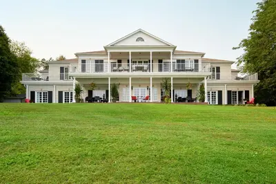 a large white house with a large yard at Somerset - A Private Retreat in Niagara on the Lake