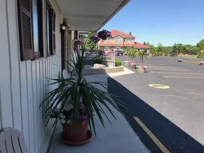 a potted plant sitting on the side of a building at Country Inn Listowel in Listowel