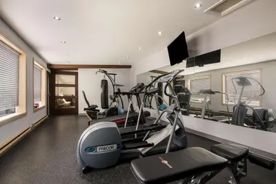 a fitness room with a gym with tread machines at Best Western Little River Inn in Simcoe