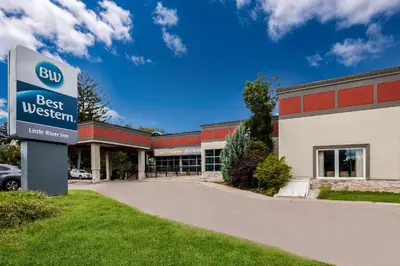 a building with a best western sign in front of it at Best Western Little River Inn in Simcoe